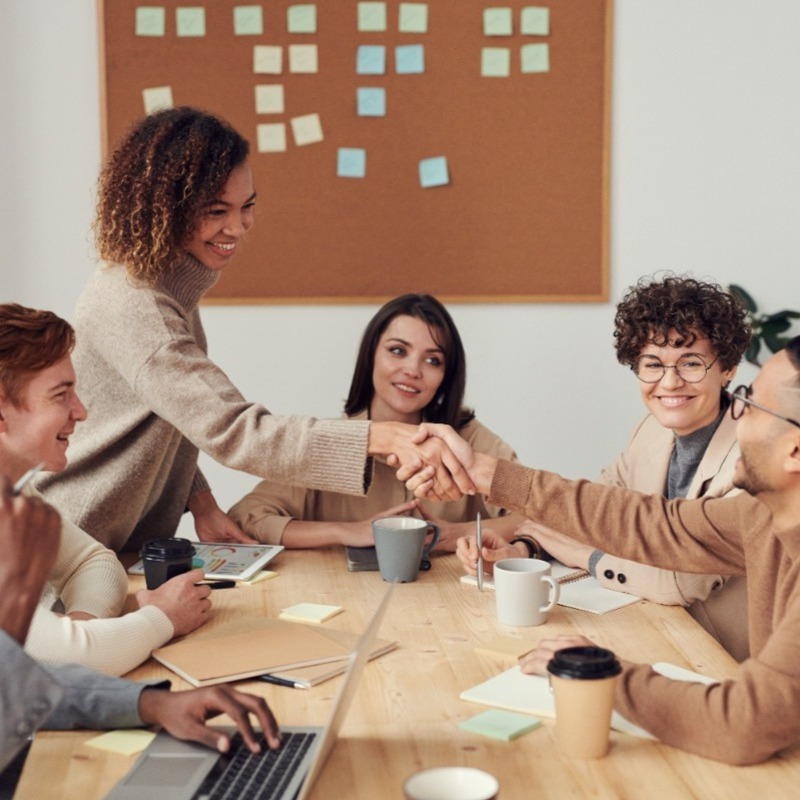 Happy employees in a boardroom